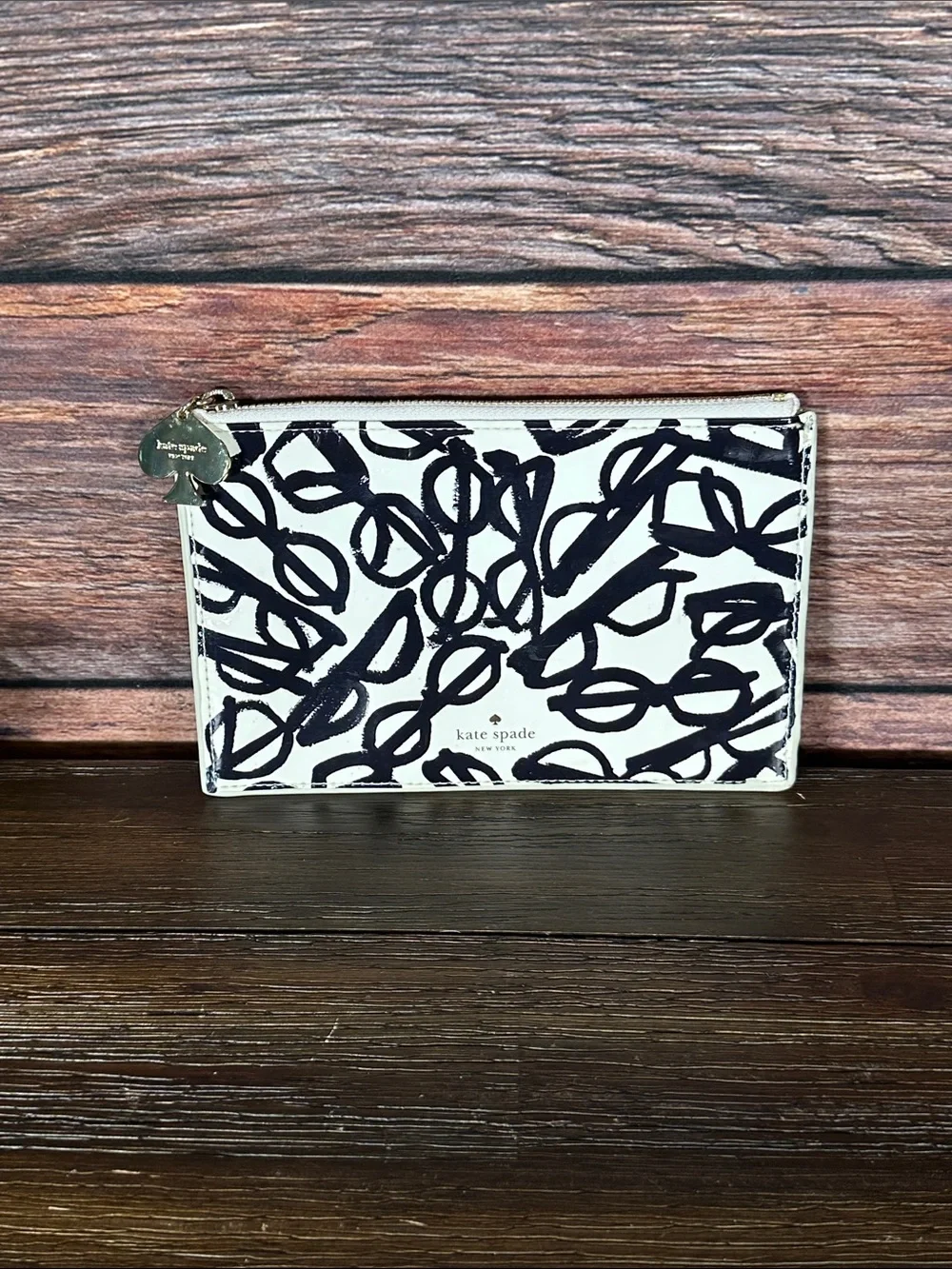 Kate Spade New York pouch features a whimsical 